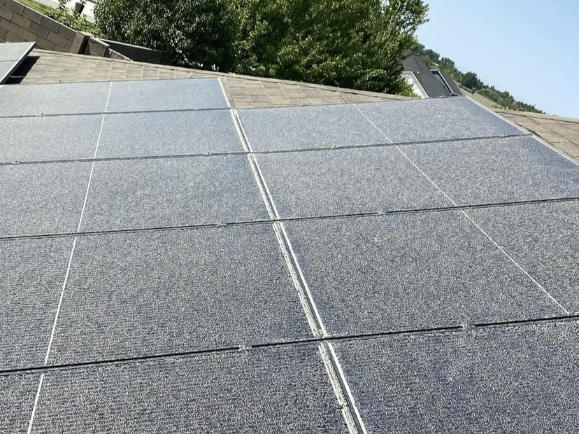 Rooftop solar array before and after cleaning, dust layer removed (before)